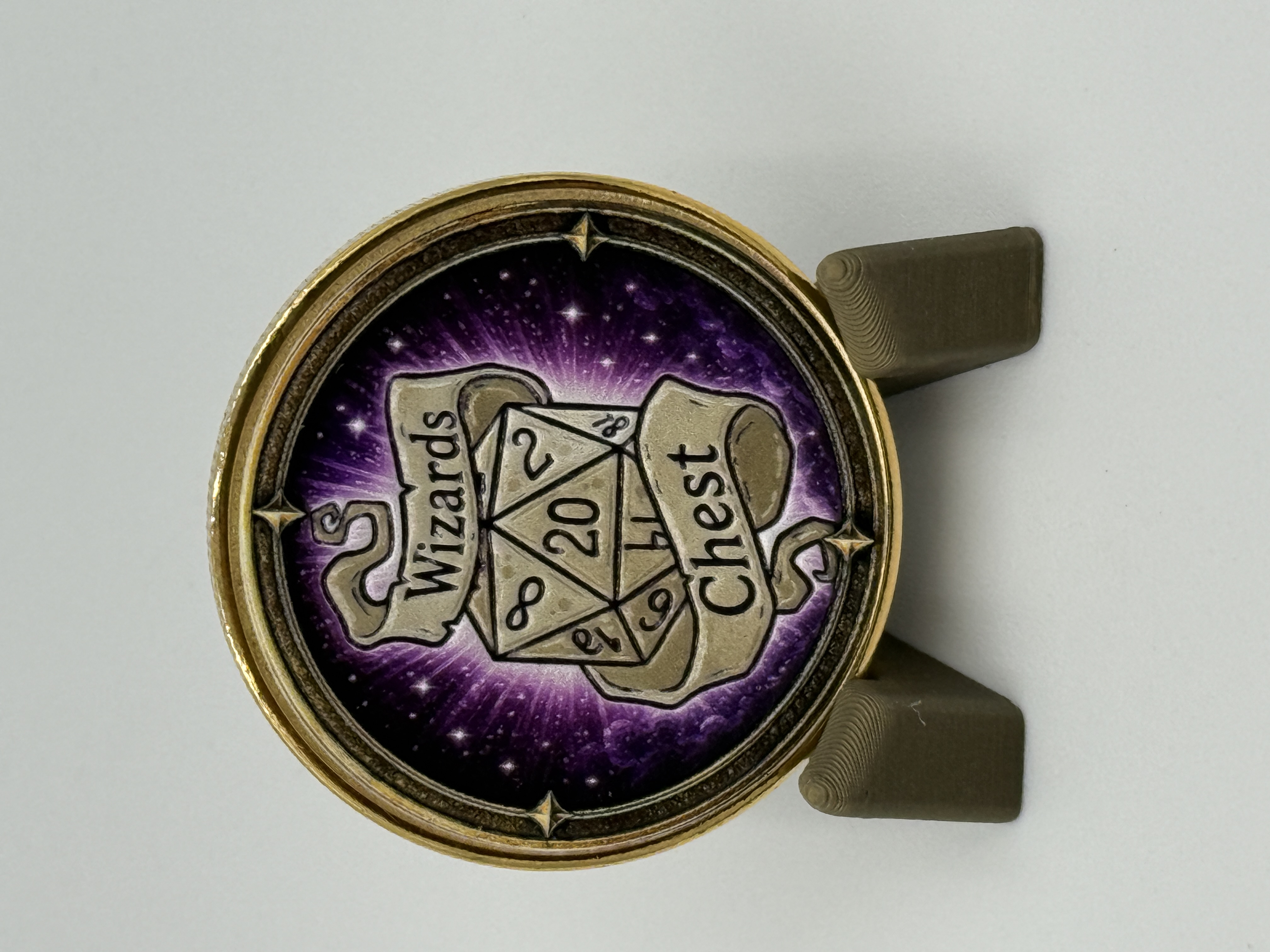 Wizards Chest coin face displayed on its stand