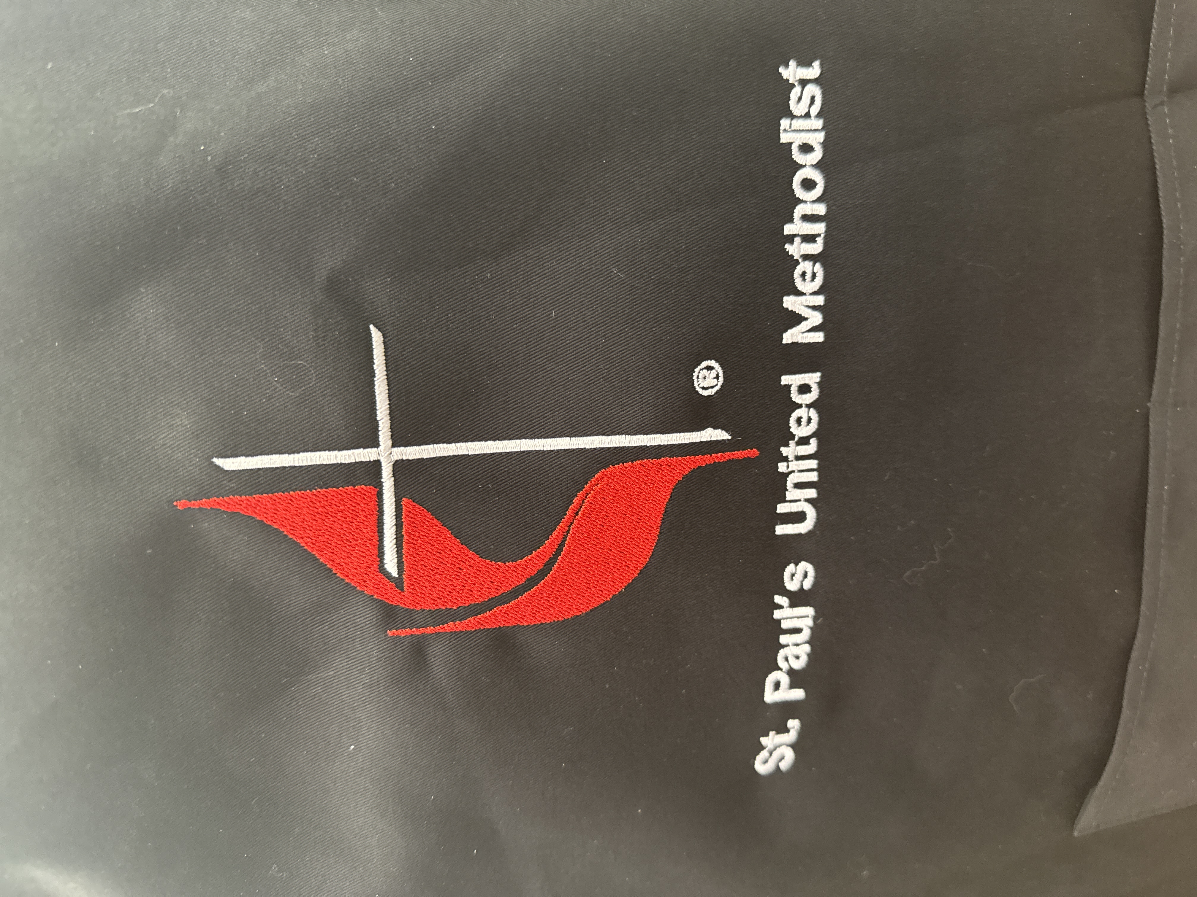 Close view of finished multicolor logo embroidery
