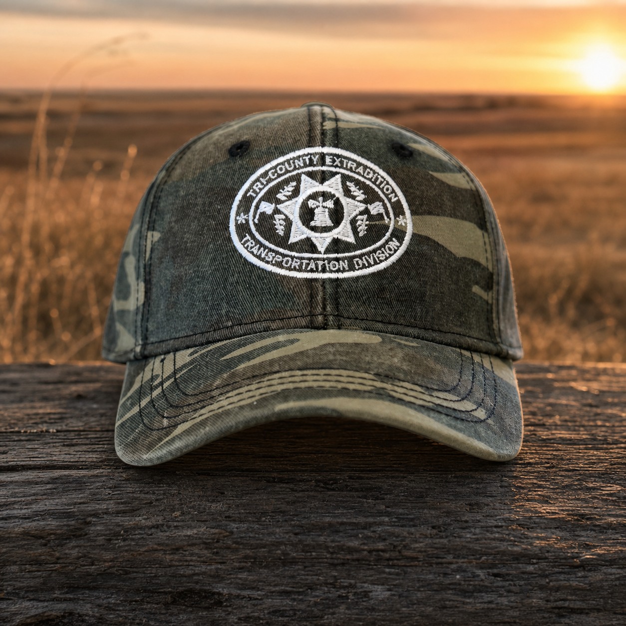 Camouflage Tri-County Extradition Transportation Division hat with white embroidery