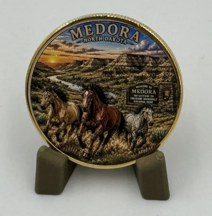 Medora commemorative coin on a display stand