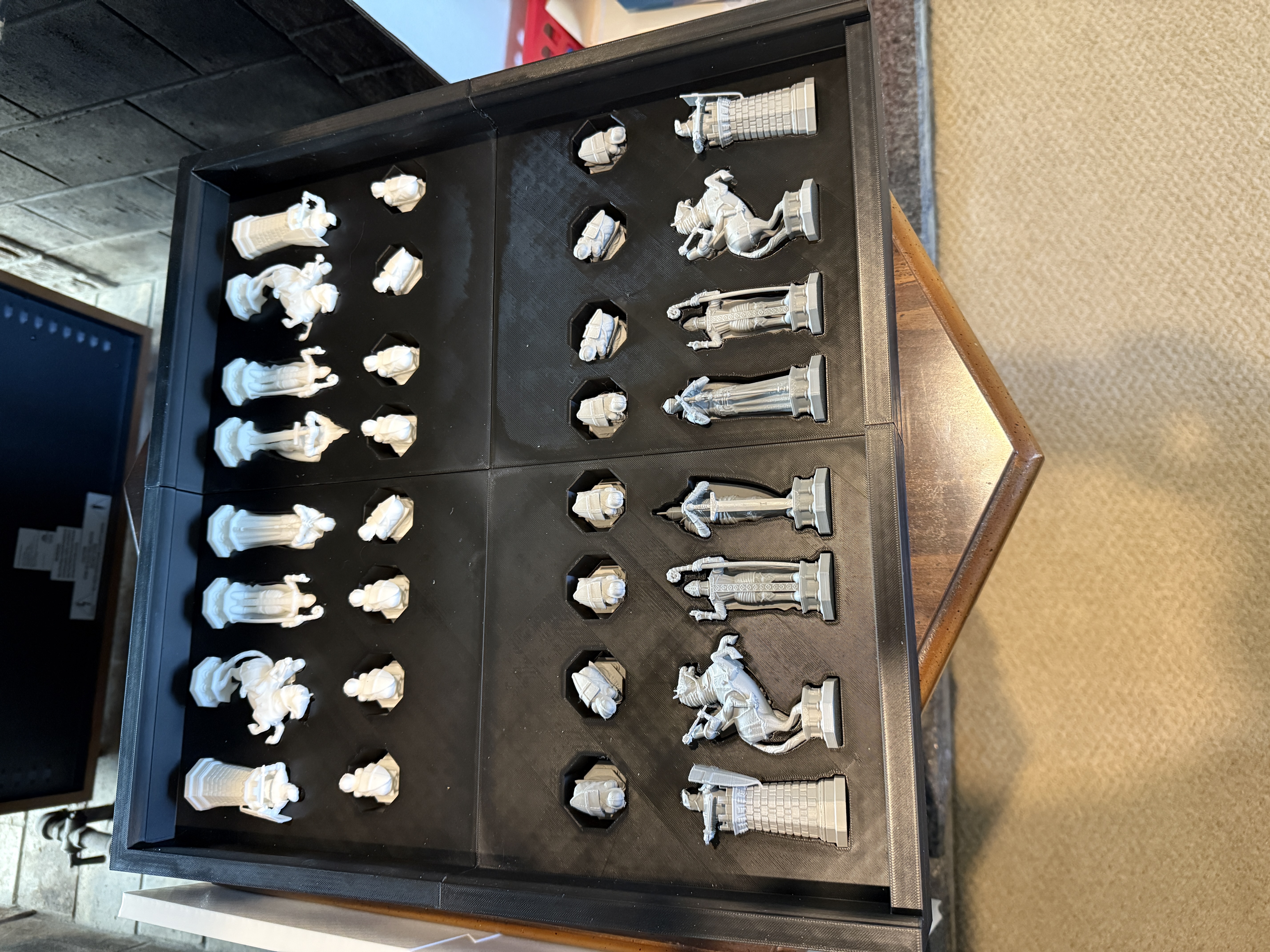 Custom 3D printed chess pieces organized in a storage tray