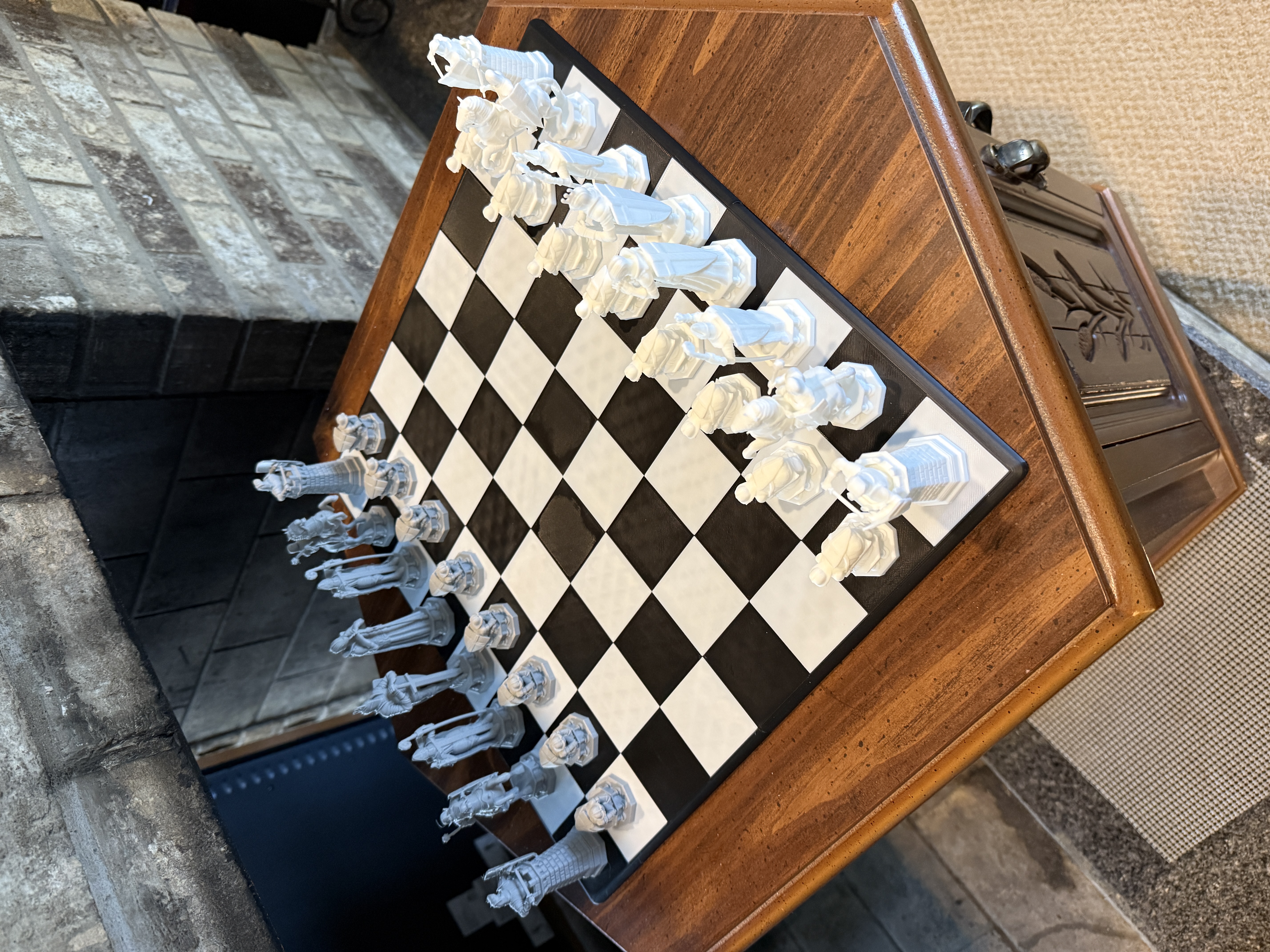 Custom 3D printed chess set arranged on a black and white board