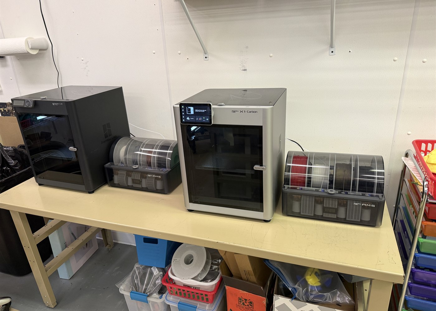Multiple 3D printers producing projects inside the WW Custom Works shop